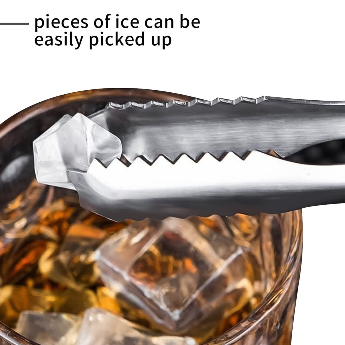 A close-up of a silver tong gripping an ice cube above a glass with more ice cubes.