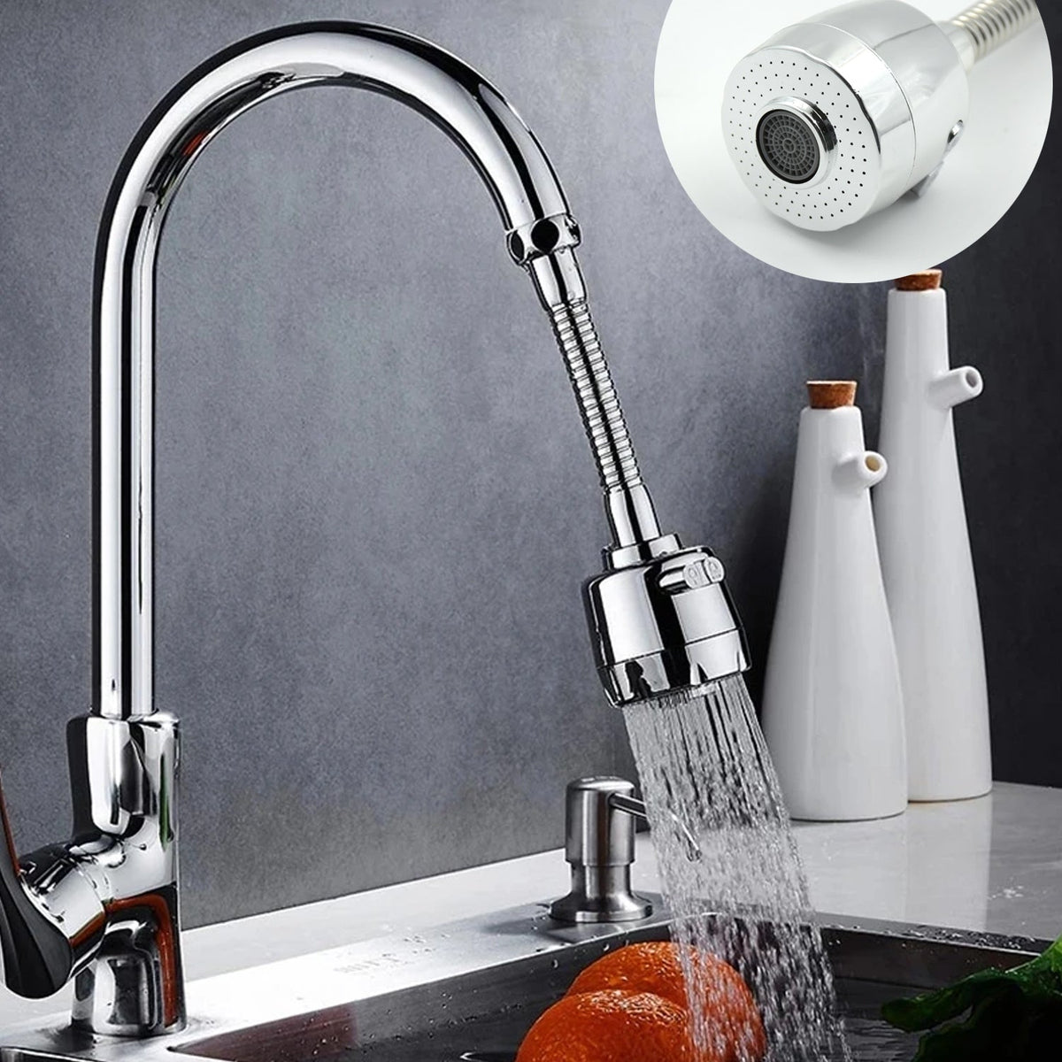 A chrome faucet with the flexible extension attached sprays water into a sink with oranges, with an inset of the sprayer