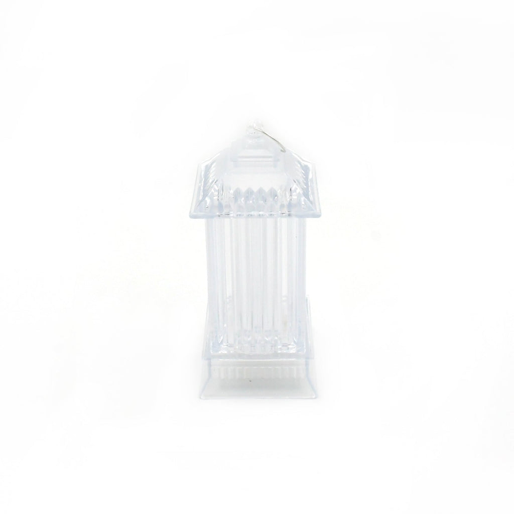 A clear, unlit LED crystal lantern lamp stands upright on a plain white background, showing its transparent structure.