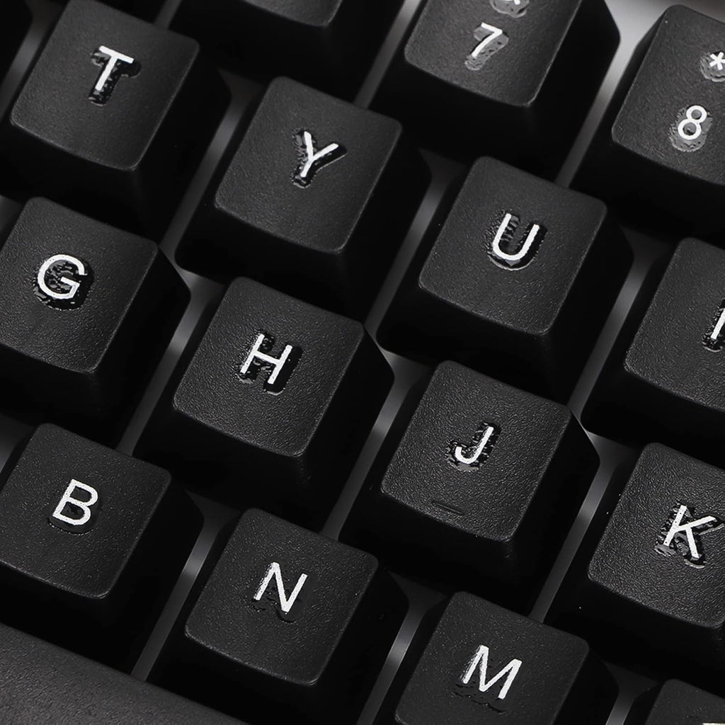 A close-up view of several black keyboard keys with white letters and numbers.