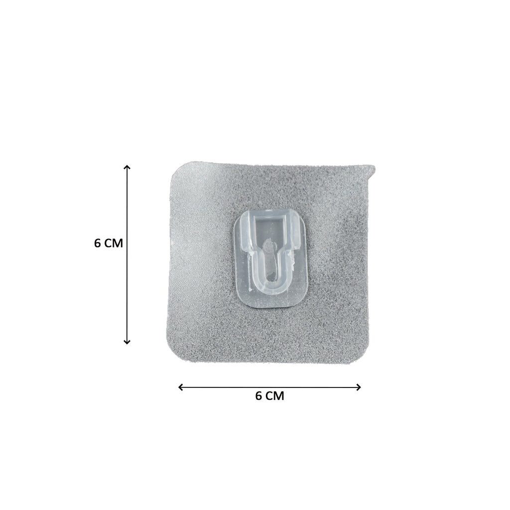 A clear adhesive hook with a gray textured backing, showing dimensions of 6 cm by 6 cm.