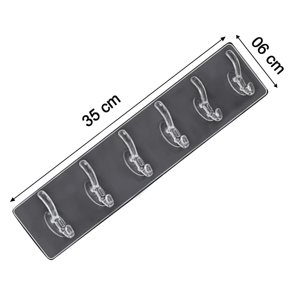 A clear plastic 6-hook adhesive wall rail is shown at an angle with dimensions of 35 cm by 6 cm.