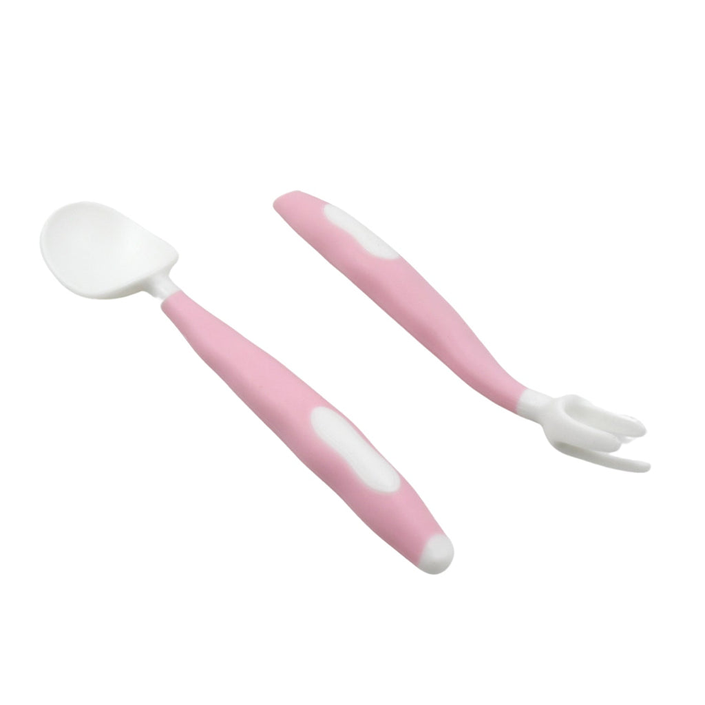 A pink and white baby spoon and fork set with bendable handles on a plain white background.