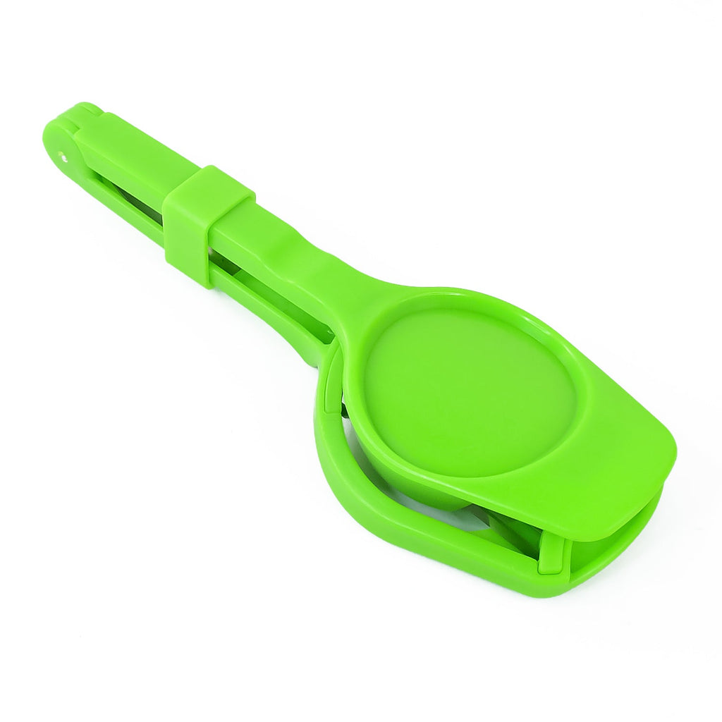 A green plastic slicer with a rounded base and handle is shown closed on a white background.