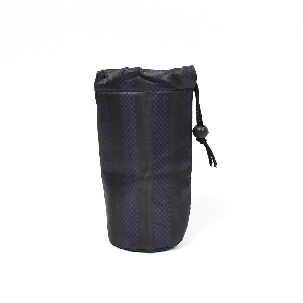 A navy blue drawstring pouch with vertical stripes stands upright on a plain white background.