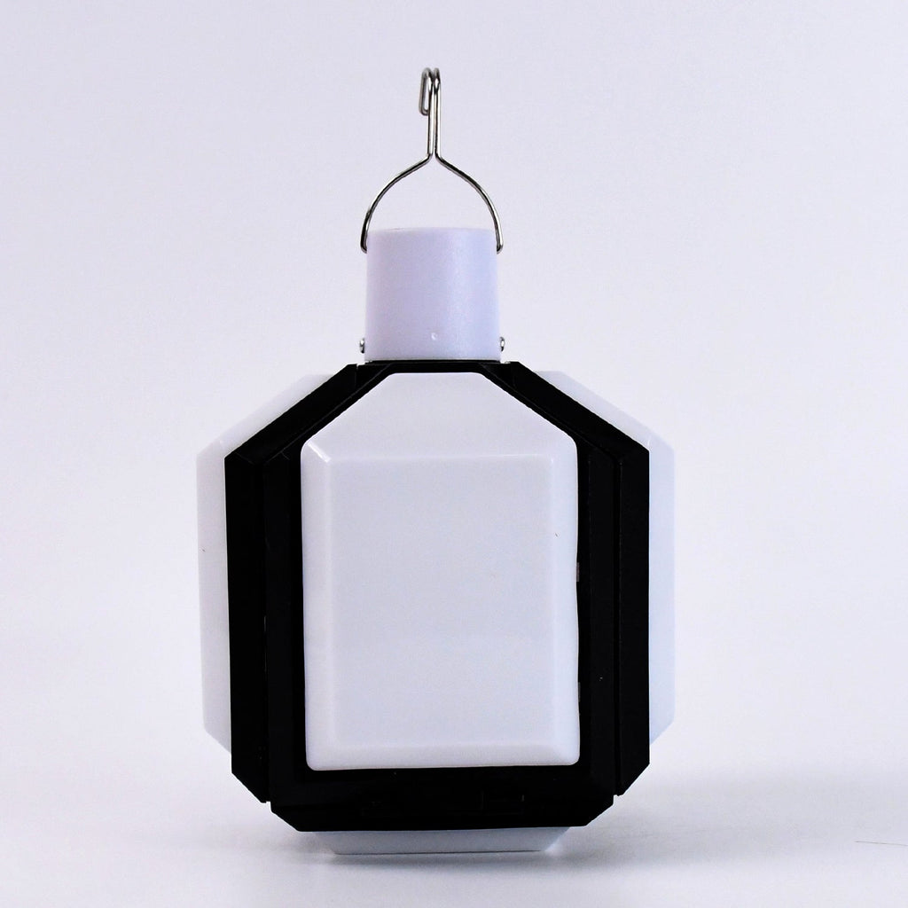 Compact white and black foldable LED lantern with a metal hook on a plain white background.