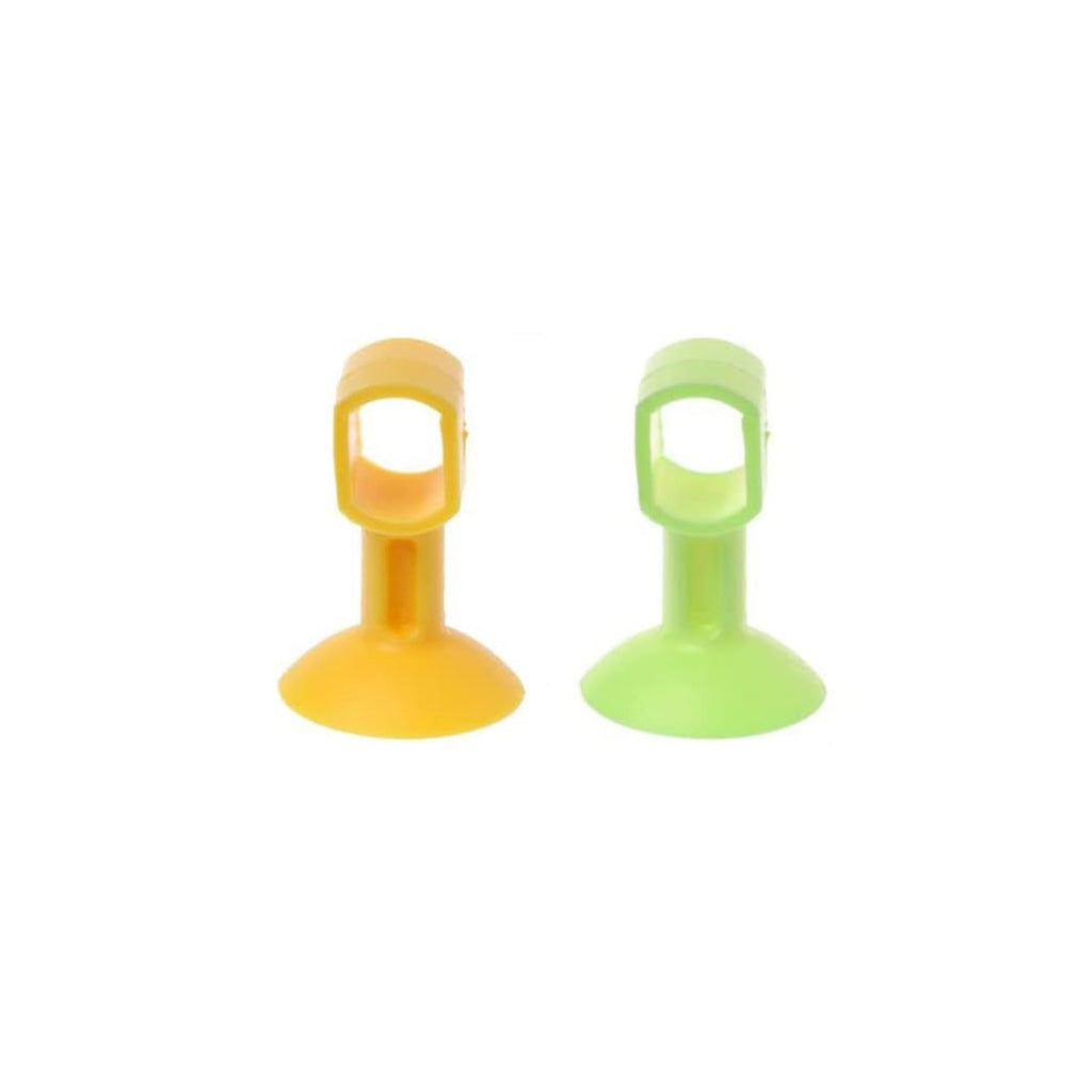Two silicone suction cup door stoppers, one yellow and one green, are shown standing upright on a white background.