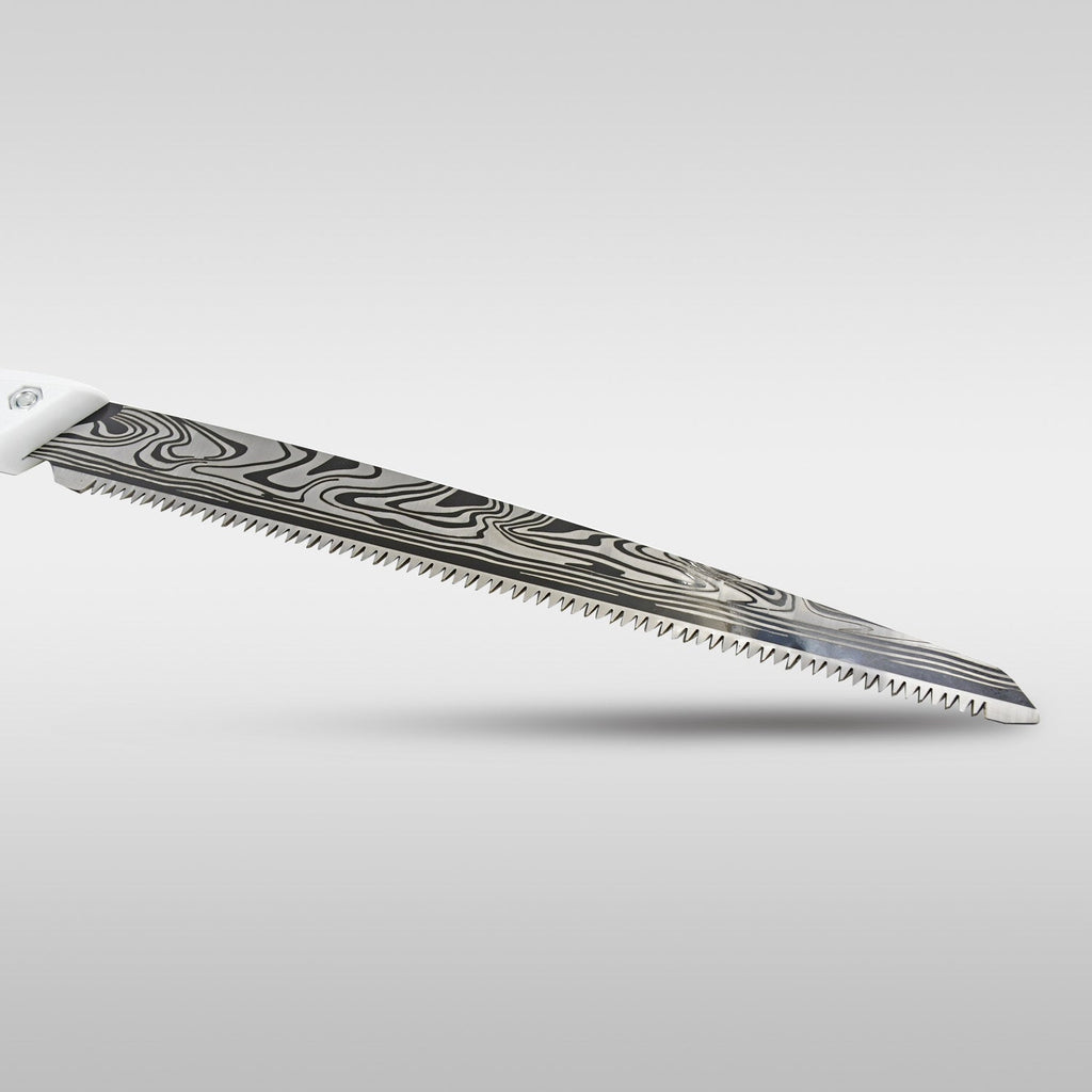 Close-up of the silver blade of the pruning saw, featuring a distinctive wavy, dark pattern and sharp teeth.