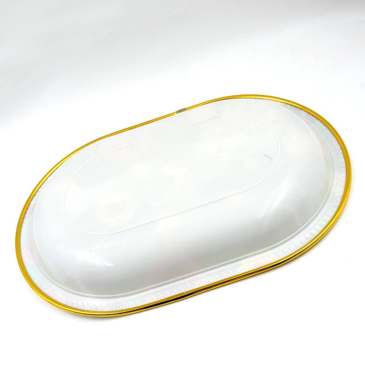 The underside of the oval serving tray is white with a gold rim, shown on a white background.