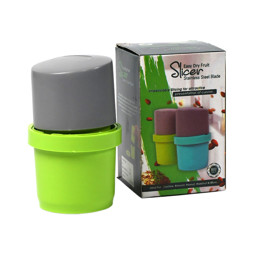 A green and gray dry fruit slicer sits next to its product box, which displays images of the slicer in different colors.