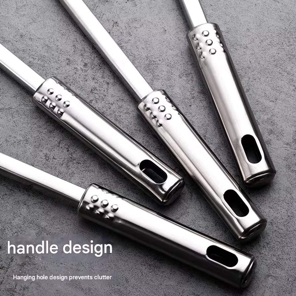 Close up of hanging holes on stainless steel kitchen utensil handles