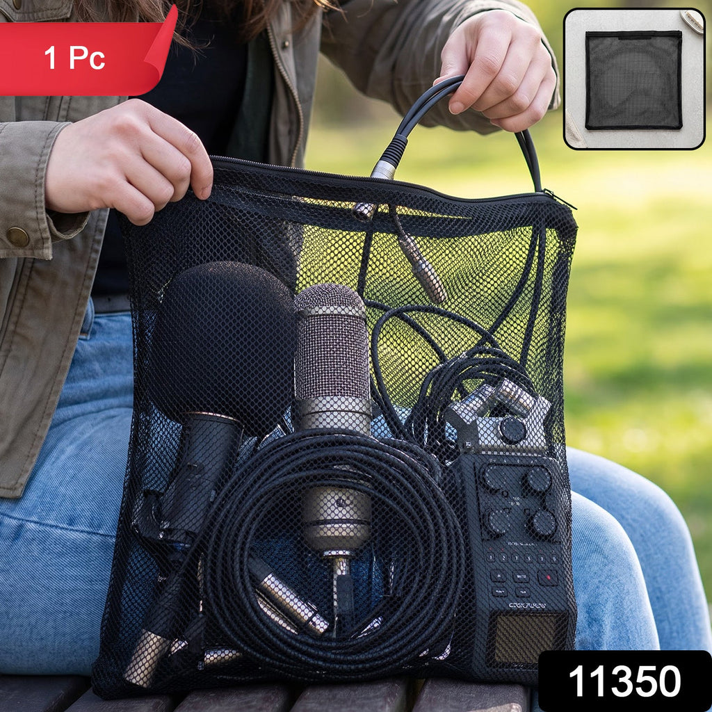 A person holds a black mesh zipper bag filled with microphones and audio cables outdoors, with a red "1 Pc" label.
