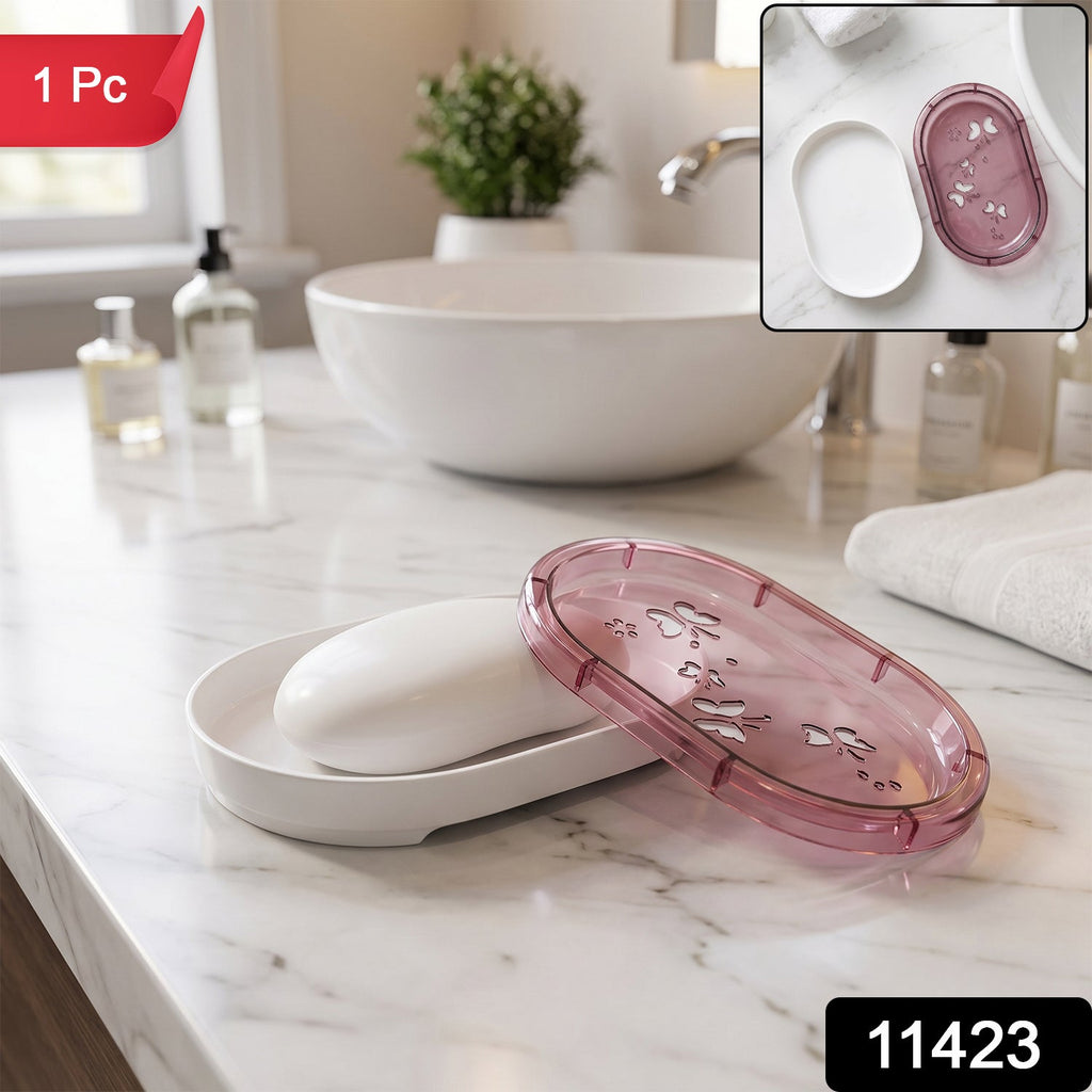 White bar of soap in a white base with a pink butterfly-patterned lid beside it on a marble counter with a small inset