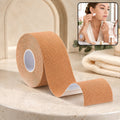 A roll of tan face lifting tape sits on a marble counter, with an inset showing a woman applying small pieces to her face.