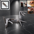 A silver multi-tool with various tools extended, including nail clippers and scissors, on a dark marble surface.