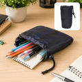 A navy blue drawstring pouch filled with colorful pencils, pens, and an eraser on a wooden desk. A smaller version of the