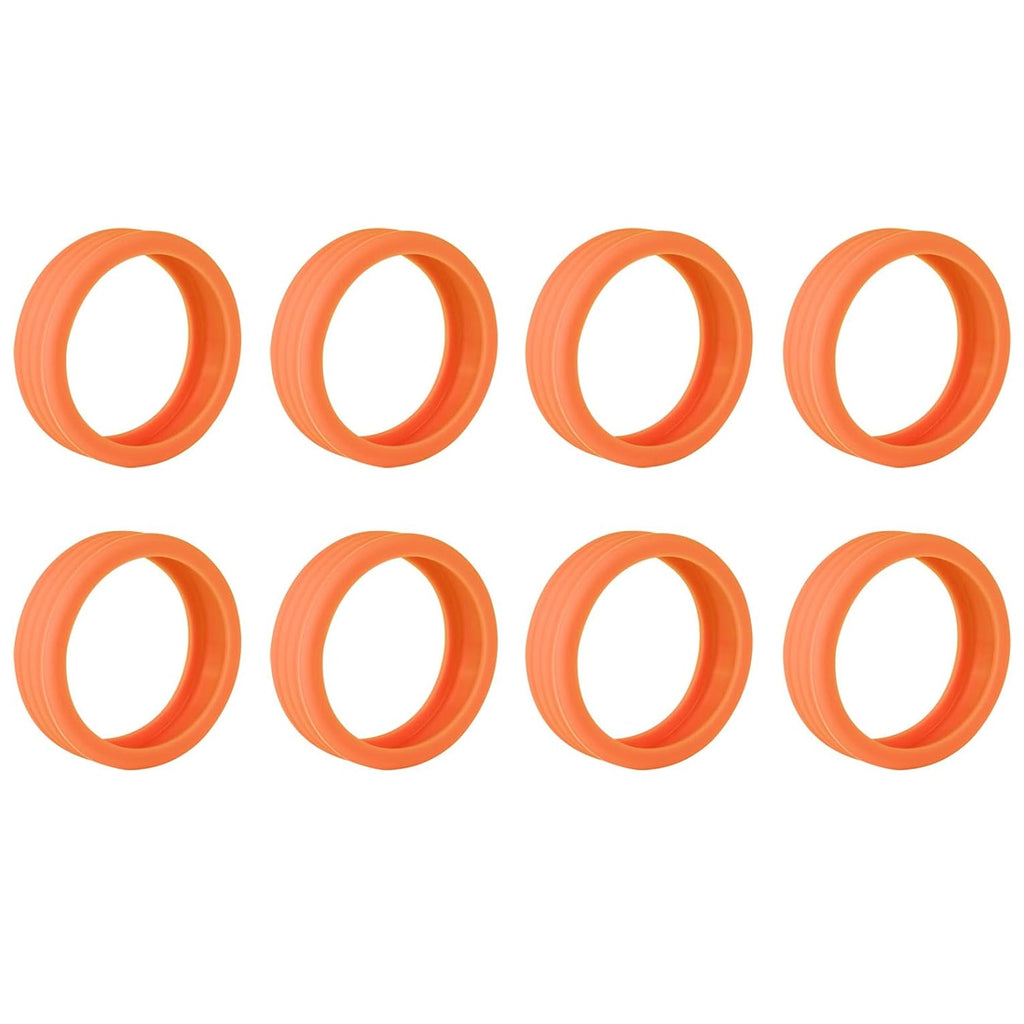 Eight orange silicone wheel covers with a ribbed texture, arranged in two rows on a white background.