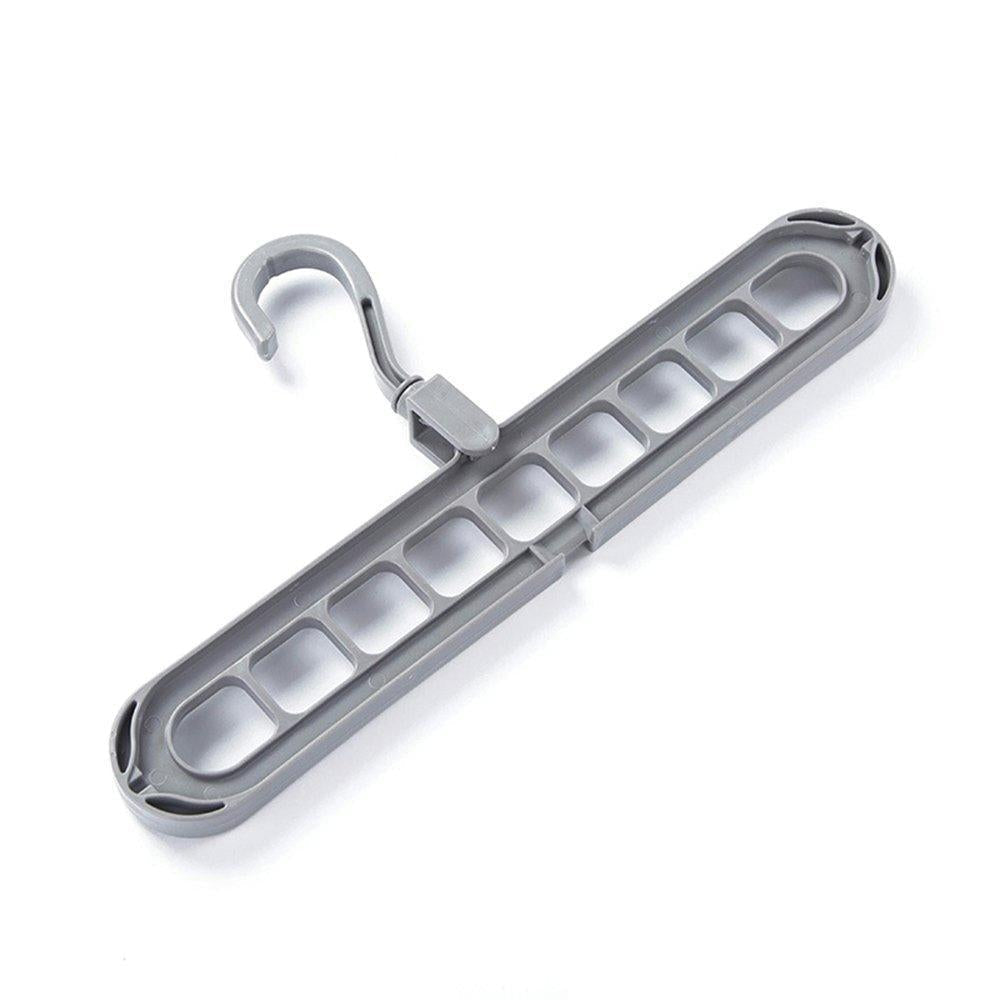 A gray plastic multi-port hanger with a nine-hole design on a plain white surface.