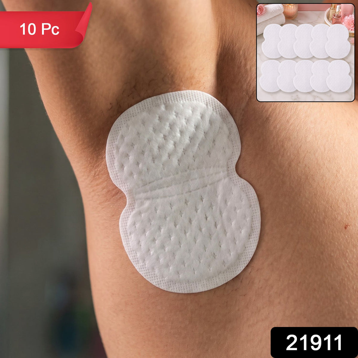 A white sweat pad on a person's armpit, with a red "10 Pc" banner and a black "21911" label.