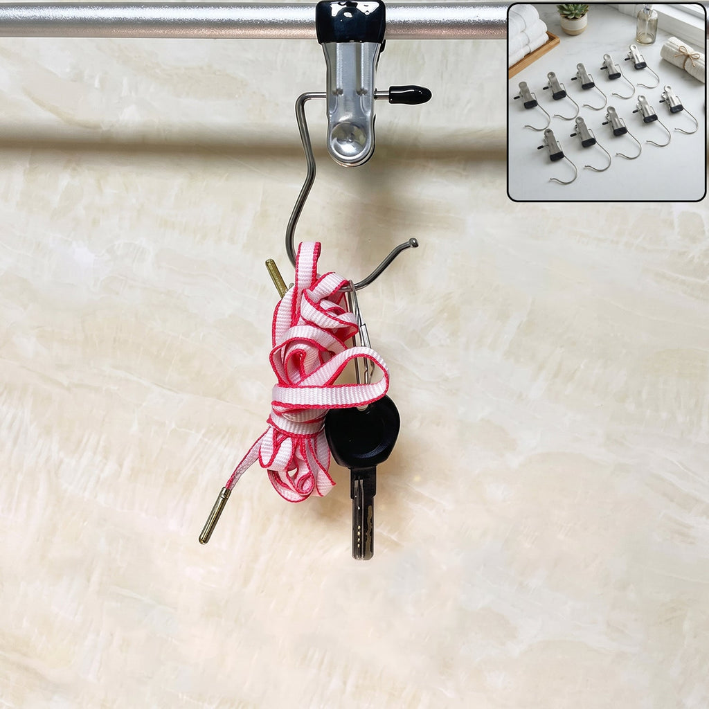 A single metal clip hanger with a black rubber tip hangs from a silver rod, holding a coiled pink and white shoelace and a
