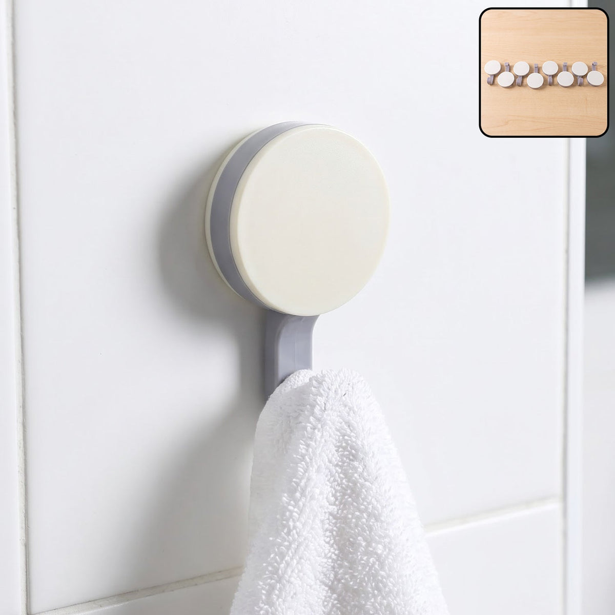 Adhesive wall hook holding towel