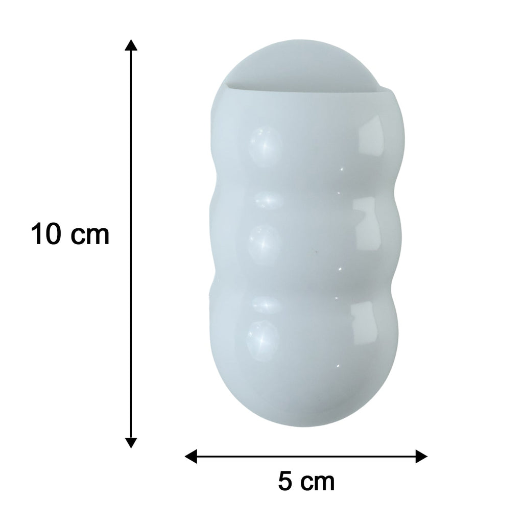 White, caterpillar-shaped holder with dimensions: 10 cm height and 5 cm width.