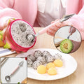 A person uses a pink-handled 2-in-1 tool to scoop dragon fruit balls, with a small inset of carving a melon.