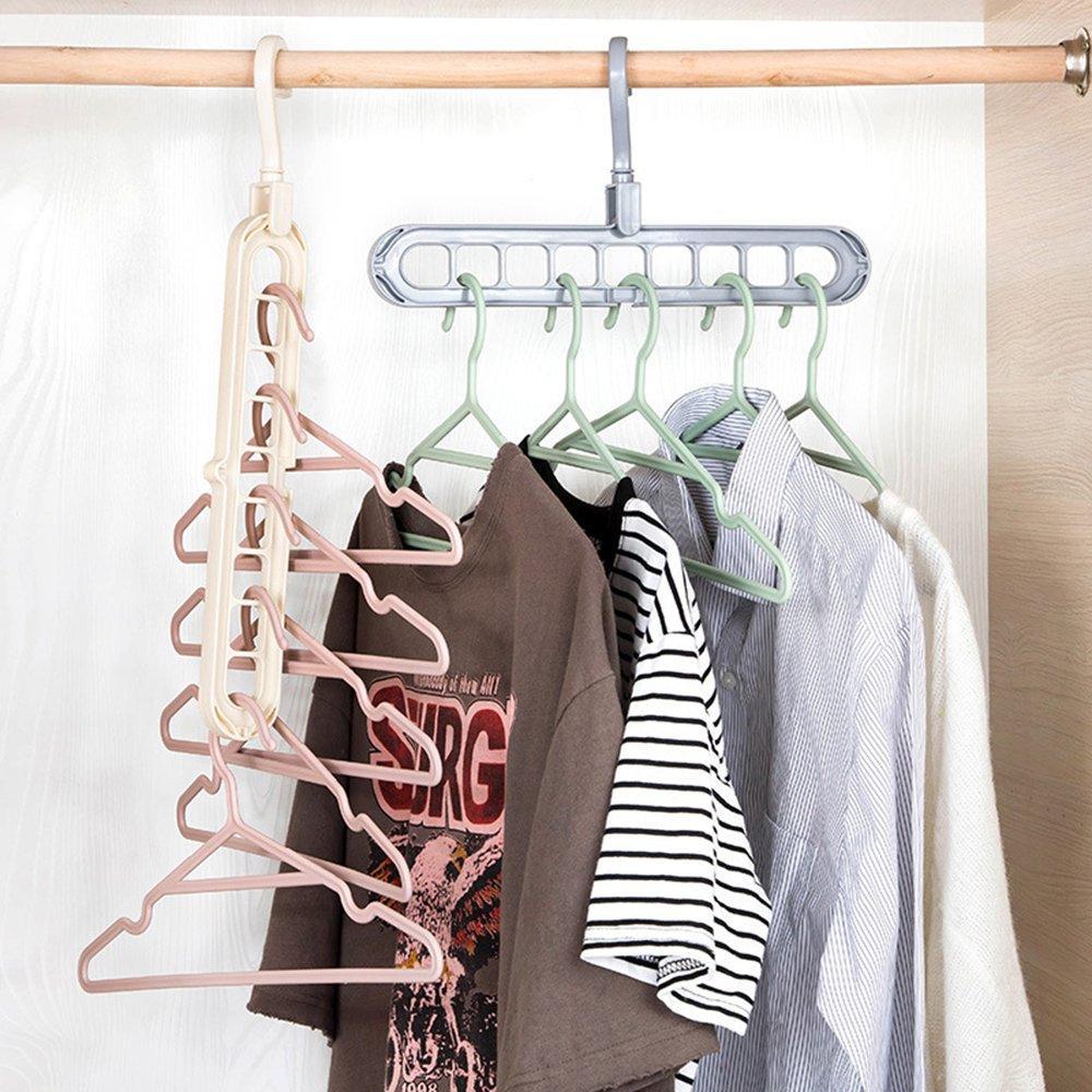 Two multi-port hangers, one gray and one beige, hold various clothing items on a wooden rod.