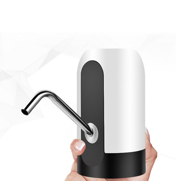 A hand holding a white and black automatic water pump with a silver spout, against a white background with geometric