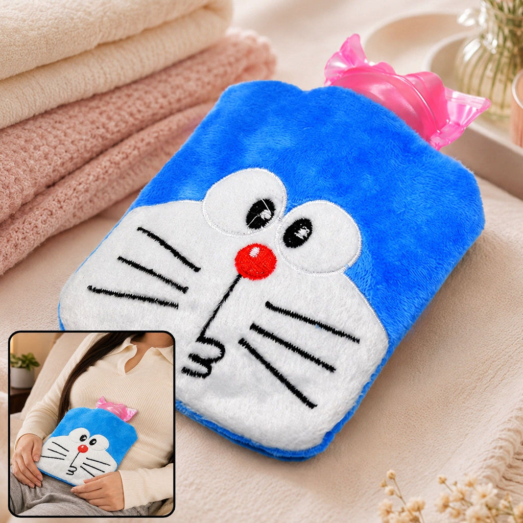 Blue Doraemon plush hot water bag with a pink stopper, held by a person in a white shirt, on a fuzzy blanket.