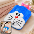 Blue Doraemon plush hot water bag with a pink stopper, held by a person in a white shirt, on a fuzzy blanket.