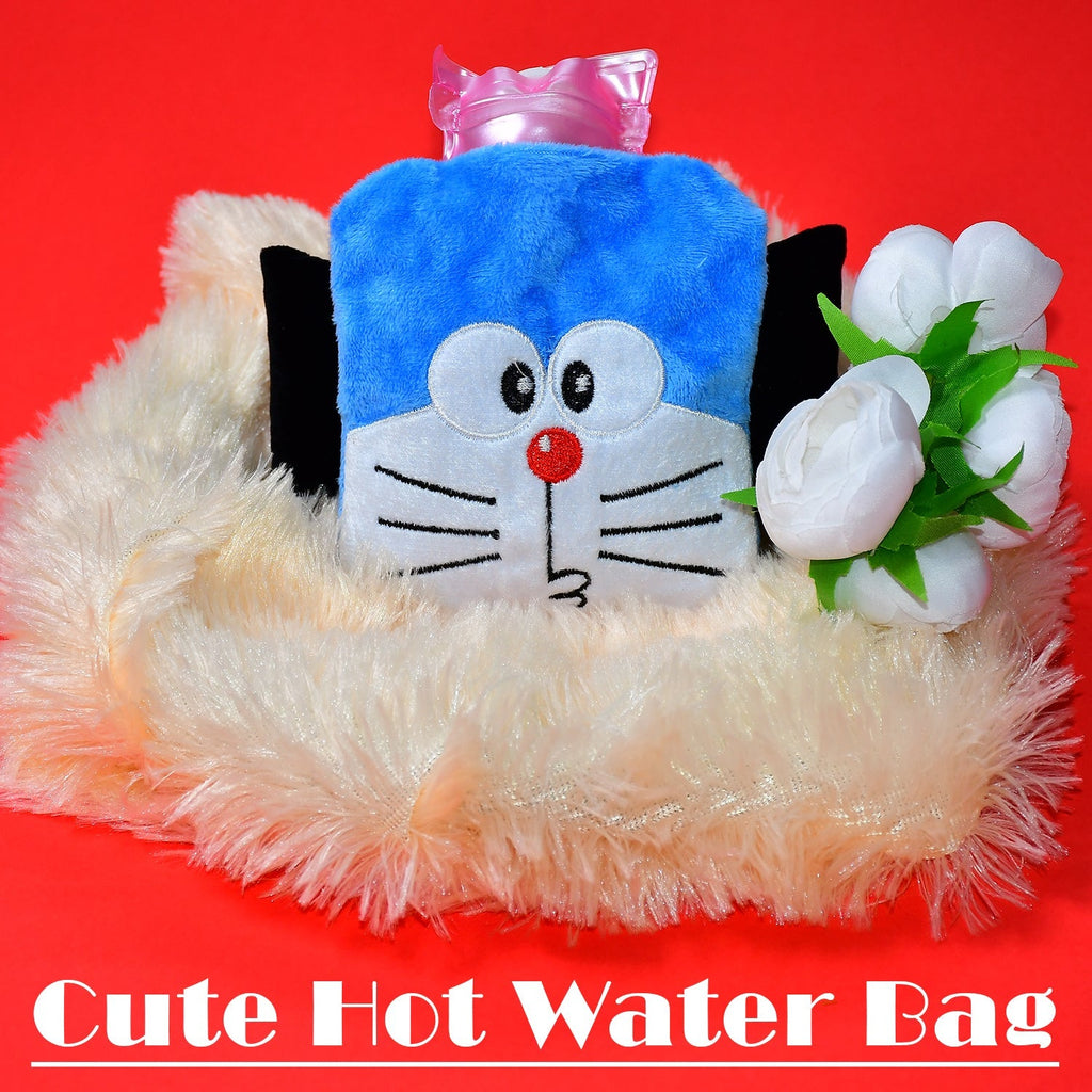 Blue Doraemon plush hot water bag with a pink stopper, resting on a cream fluffy surface with white flowers.