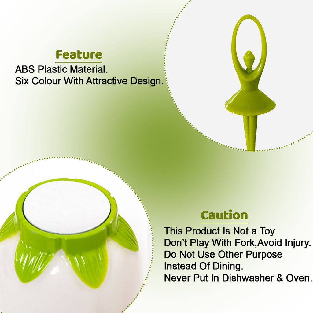A close-up of a green dancing doll fruit fork and the base of the white flower-shaped stand with green accents.