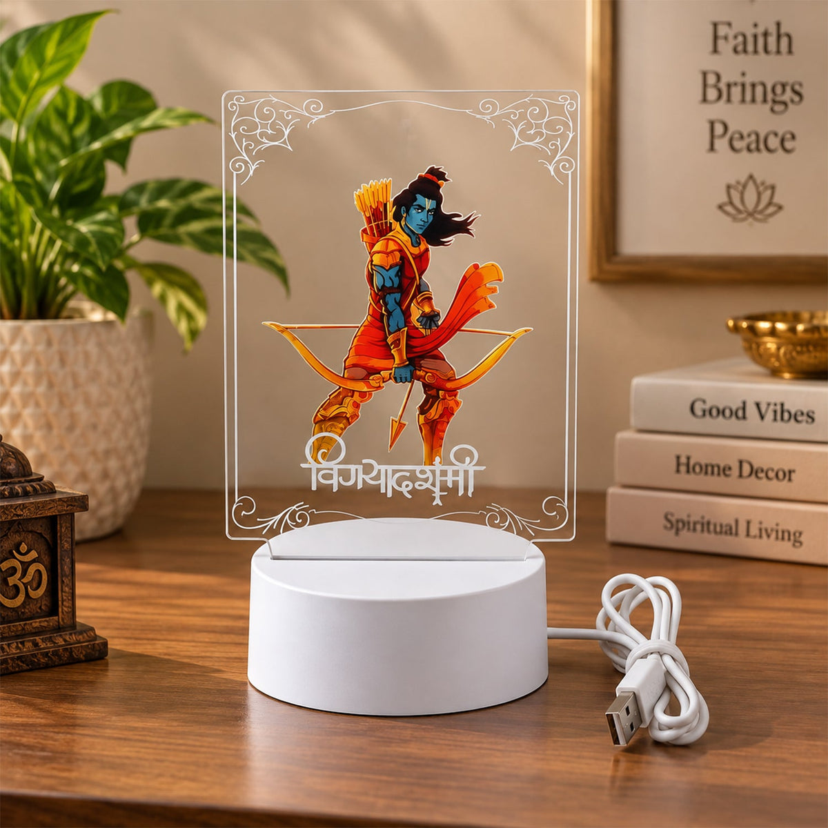 Lord Ram 3D LED lamp with a white glow, displaying a blue-skinned deity holding a bow, on a wooden desk with books.