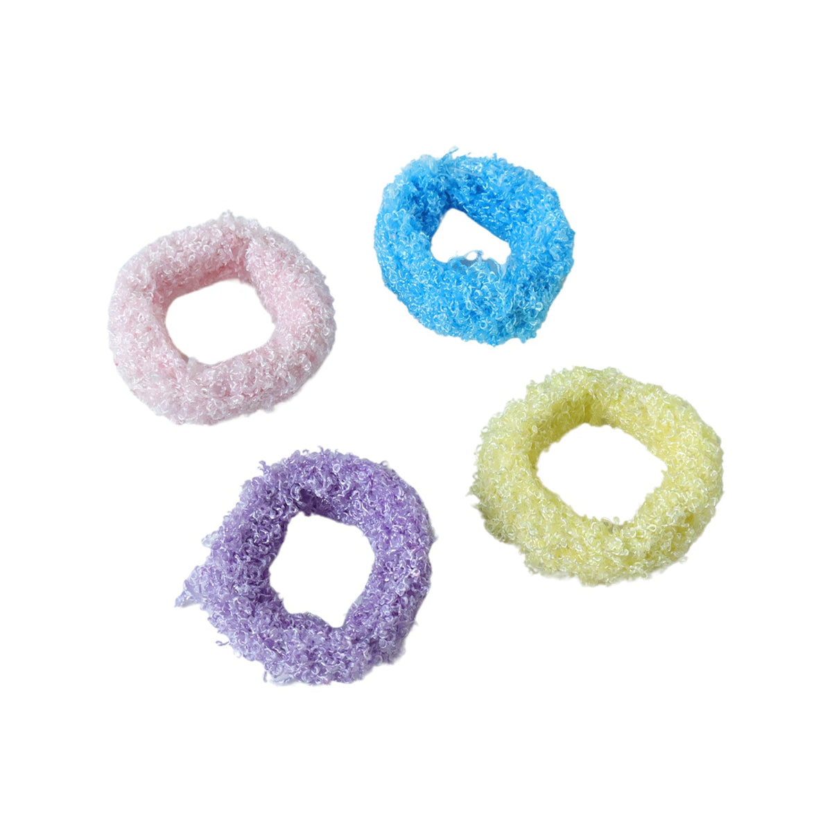 Four individual fluffy elastic hair bands in pink, blue, purple, and yellow are scattered on a white background.