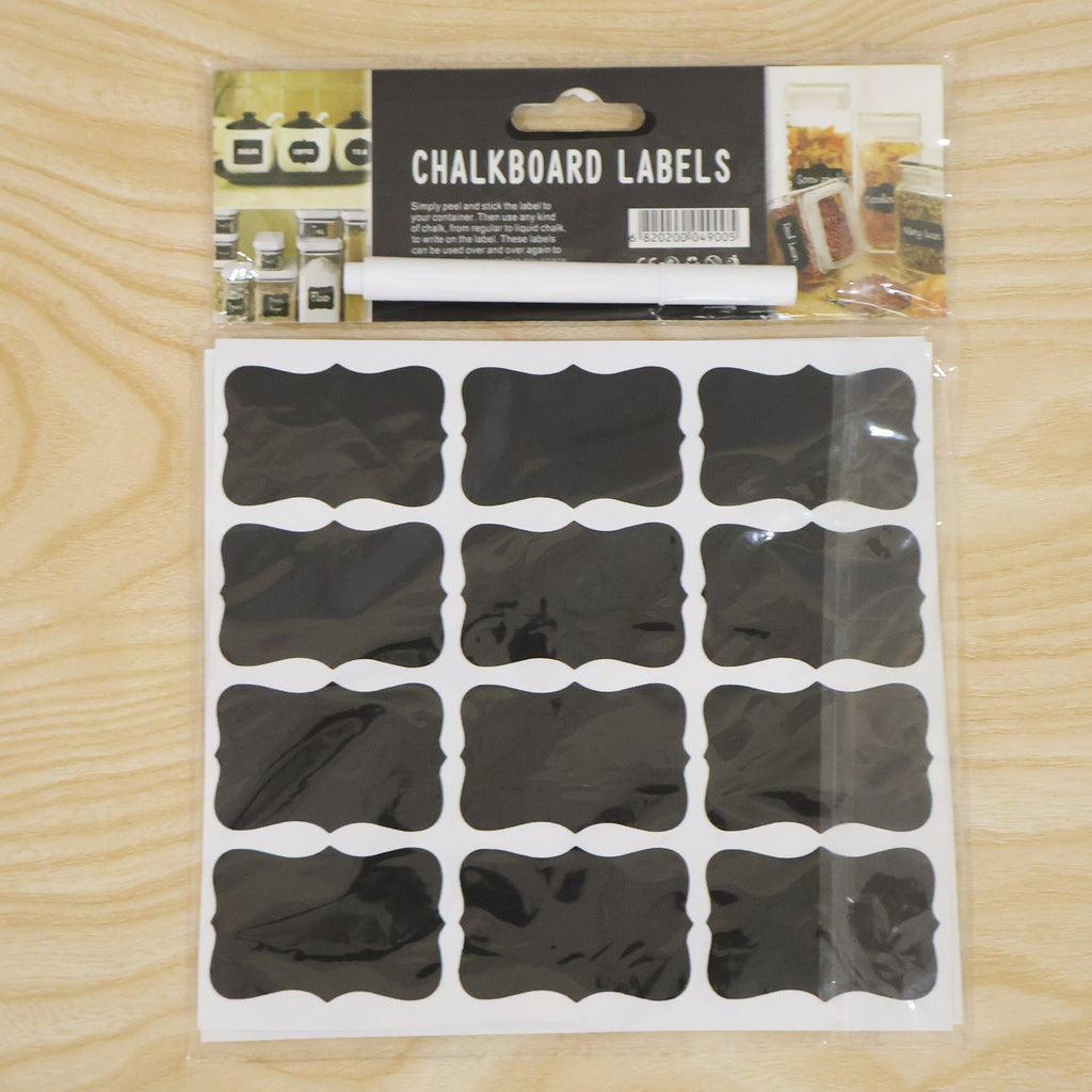 A packaged set of chalkboard labels and a white marker, with product information on the cardboard header.