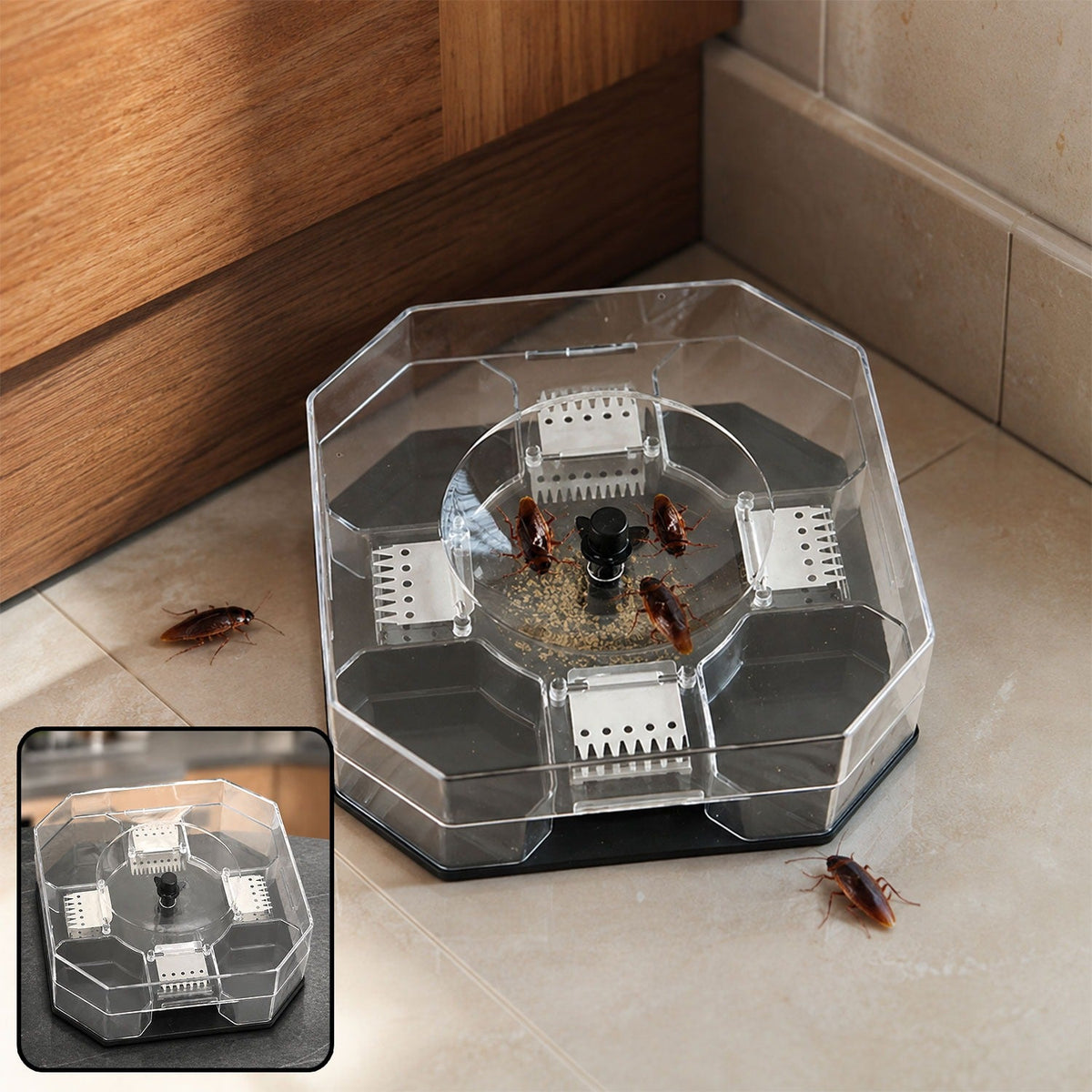 Clear octagonal cockroach trap with bait and several cockroaches on a tiled floor next to a wooden cabinet.