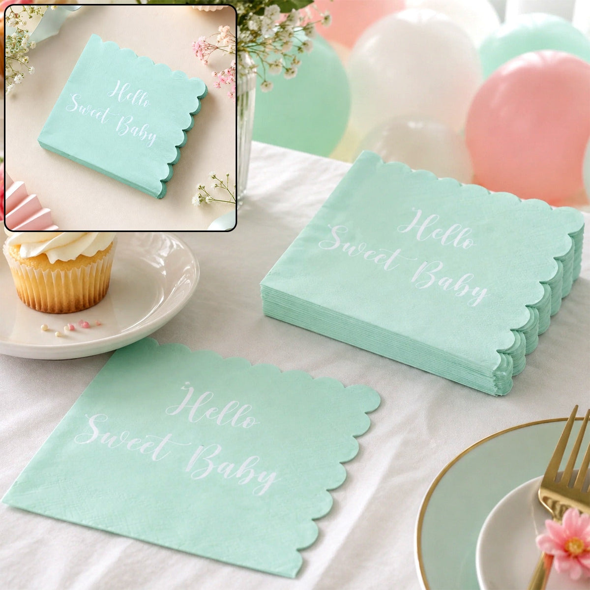 A stack of mint green scalloped napkins with "Hello Sweet Baby" in white script, next to a cupcake and balloons.