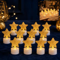 Twelve LED tealights with golden mesh stars on a dark blue tablecloth, with a blurred background.