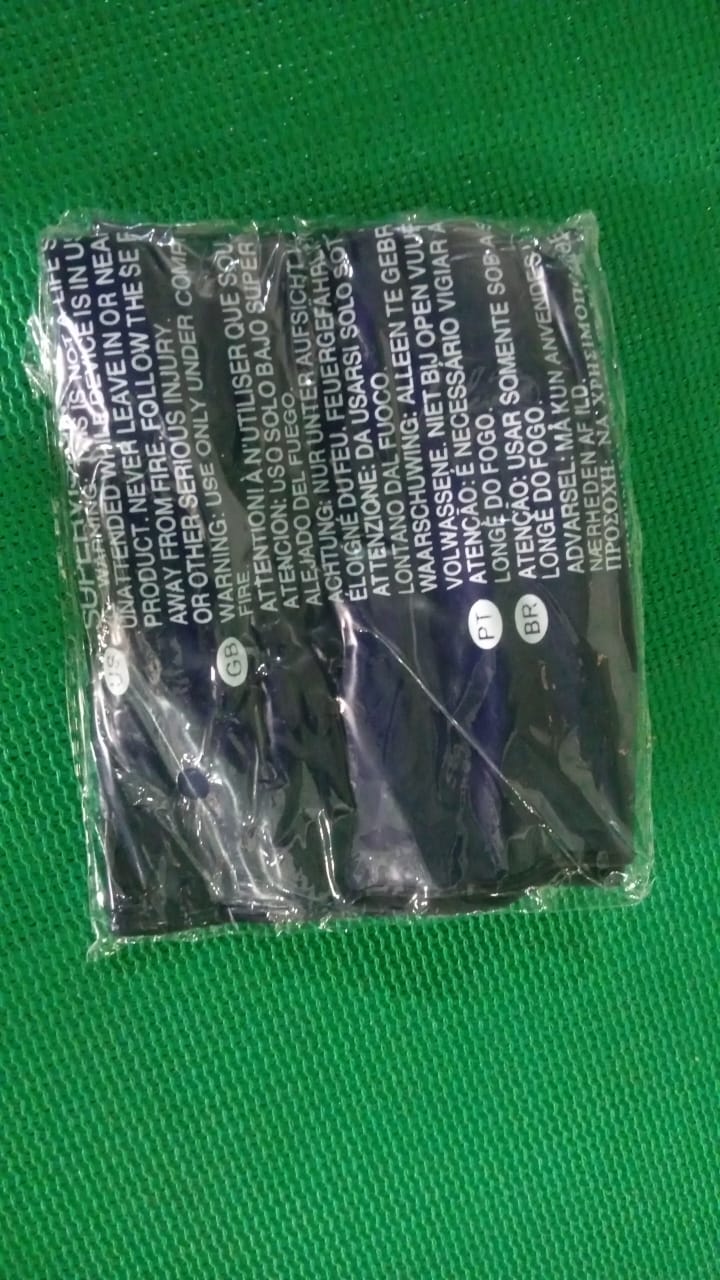 Comparison shot showing the compact size of the deflated blue velvet travel pillow.